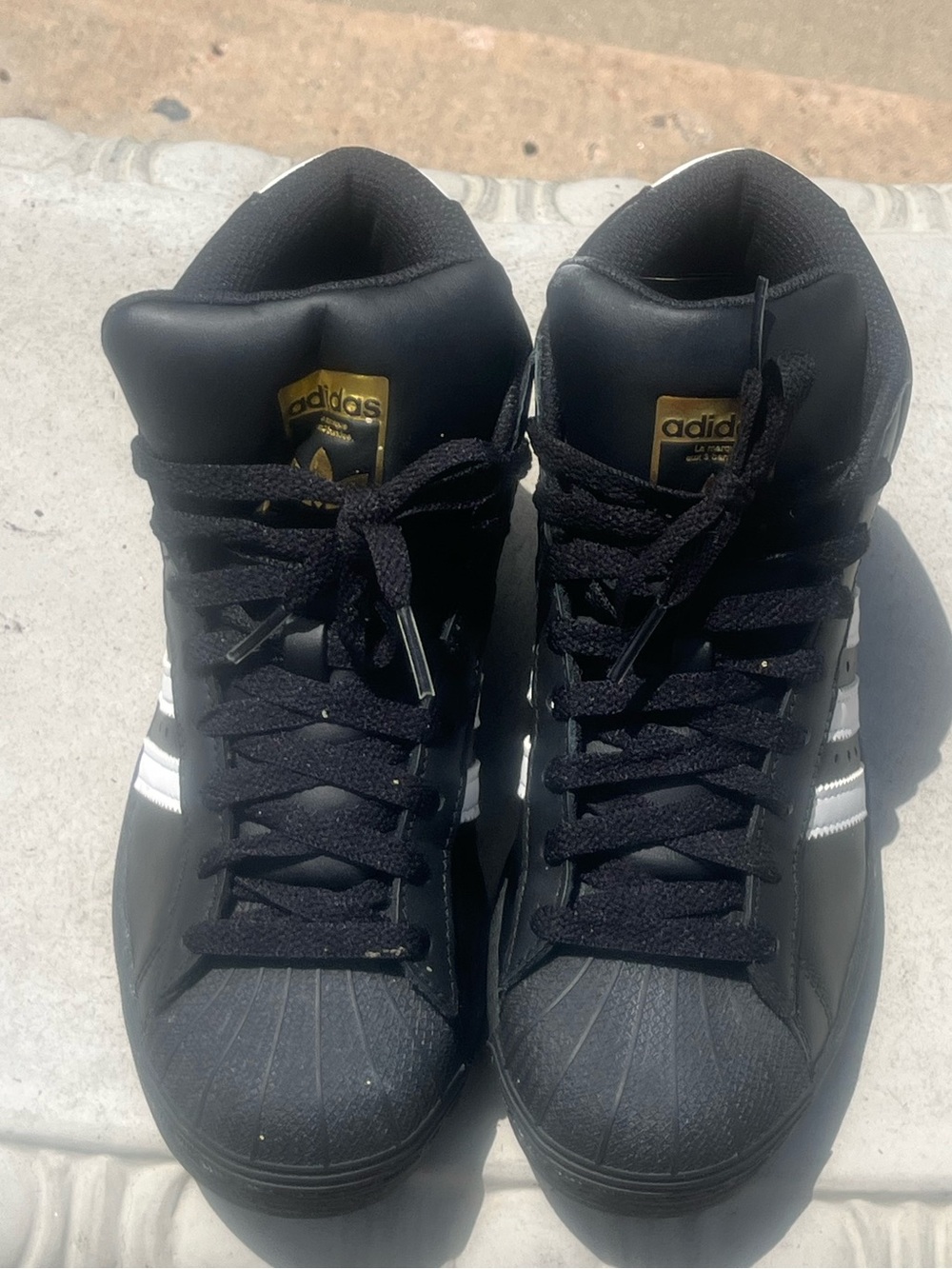 Adidas pro-model high top sneakers.